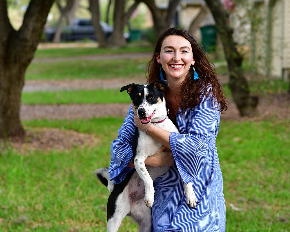 Photo from Central Texas Animal Chiropractor of Dr Amanda Massey holding a dog she has just adjusted.